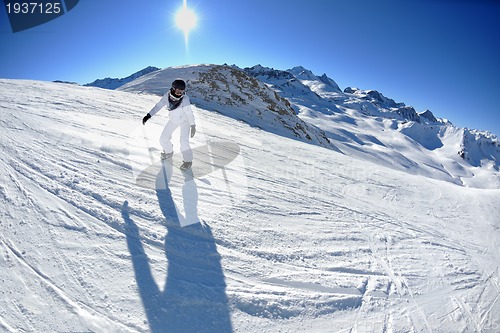 Image of skiing on fresh snow at winter season at beautiful sunny day