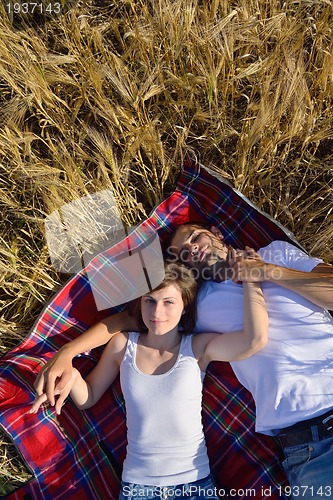 Image of happy couple in wheat field