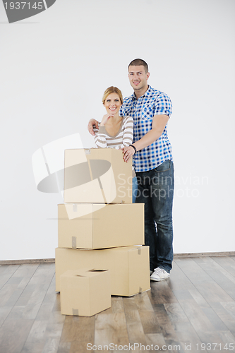 Image of Young couple moving in new home