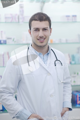 Image of pharmacist chemist man in pharmacy drugstore