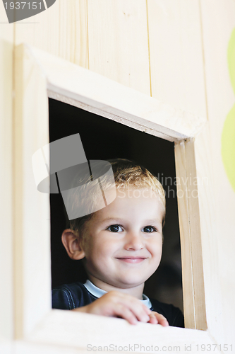 Image of happy child in a window