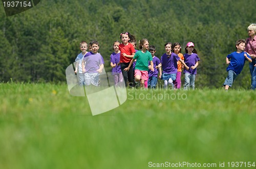 Image of happy kids group  have fun in nature