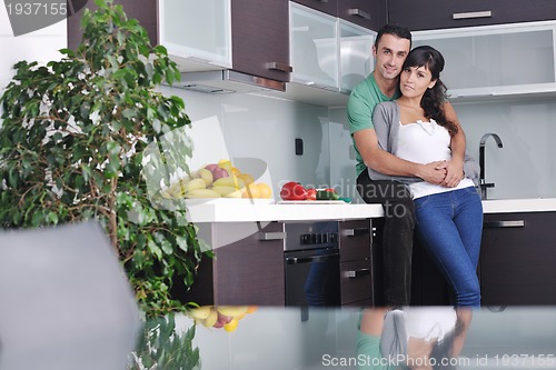 Image of young couple have fun in modern kitchen
