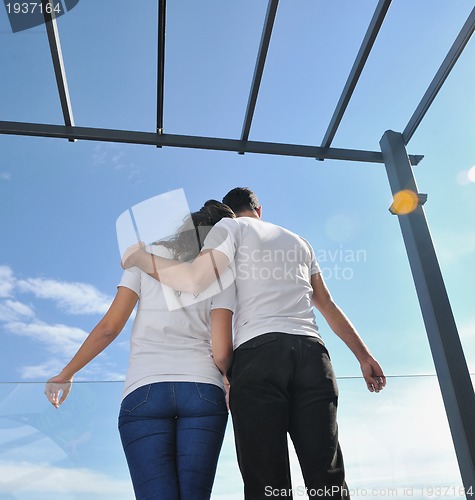 Image of couple relaxing on balcony