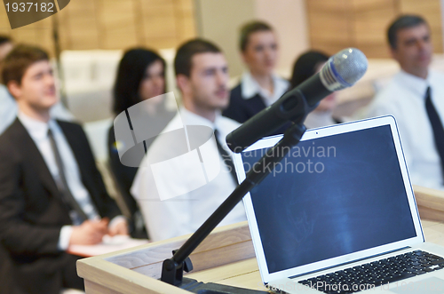 Image of laptop on conference speech podium