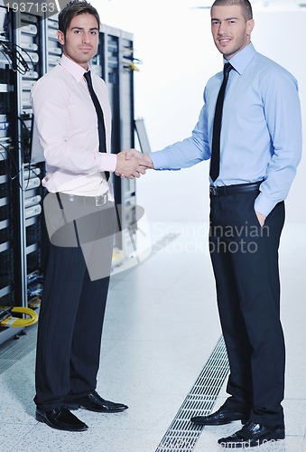 Image of it enineers in network server room