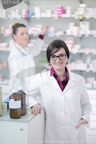 Image of team of pharmacist chemist woman  in pharmacy drugstore