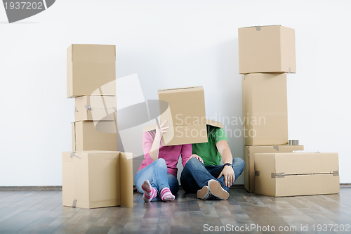 Image of Young couple moving in new house