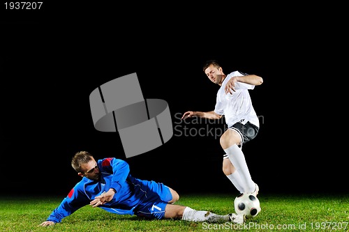 Image of football players in action for the ball