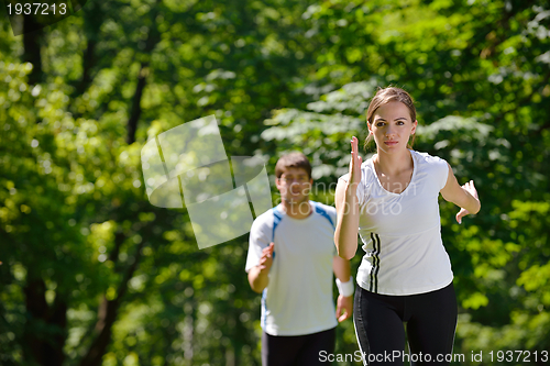 Image of Young couple jogging