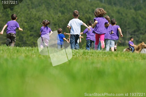 Image of happy kids group  have fun in nature