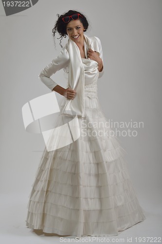 Image of elegant woman in fashionable dress posing in the studio