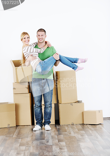 Image of Young couple moving in new house