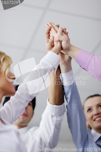 Image of business people group joining hands