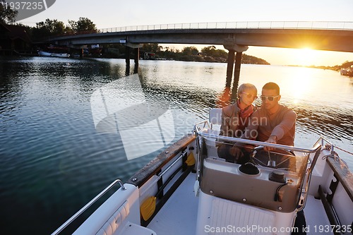 Image of couple in love  have romantic time on boat