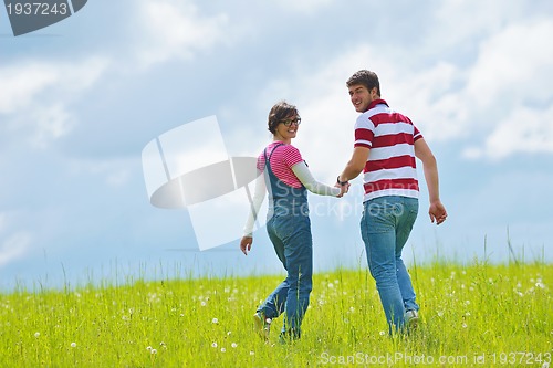 Image of romantic young couple in love together outdoor