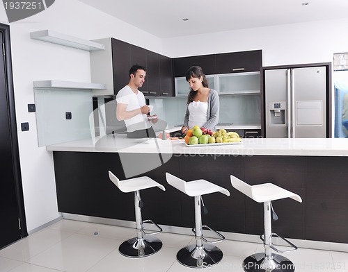 Image of young couple have fun in modern kitchen