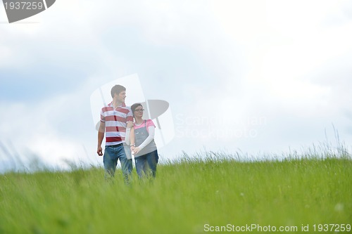 Image of romantic young couple in love together outdoor