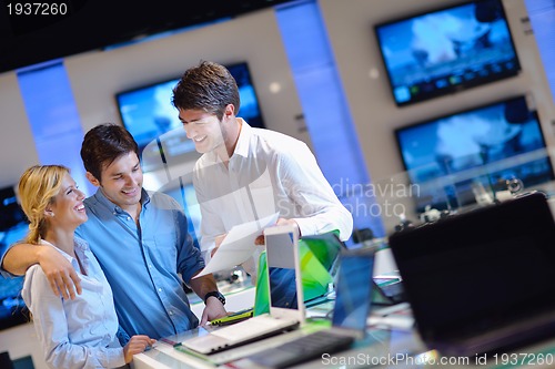 Image of people buy  in consumer electronics store