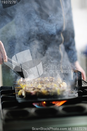 Image of chef preparing meal