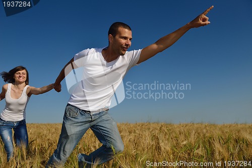 Image of happy couple in wheat field