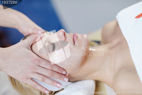 Image of Beautiful young woman in spa