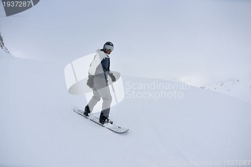 Image of skiing on fresh snow at winter season at beautiful sunny day