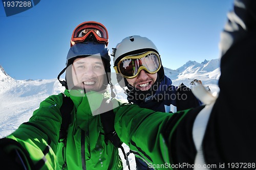 Image of winter portrait of friends at skiing