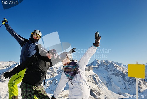 Image of winter portrait of friends at skiing