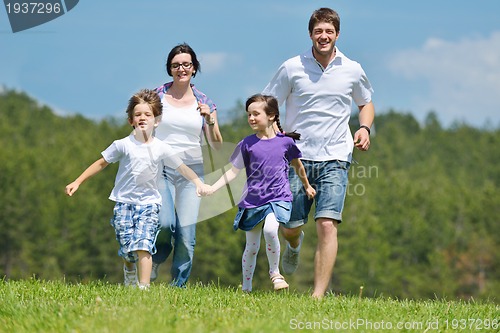 Image of happy young family have fun outdoors