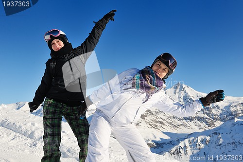 Image of winter portrait of friends at skiing