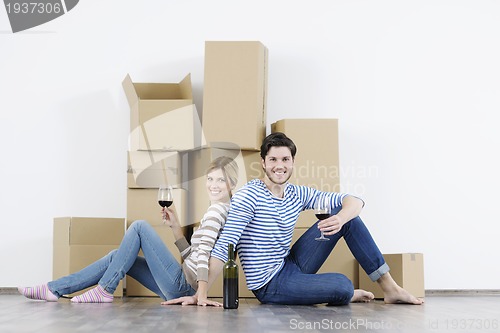 Image of Young couple moving in new home