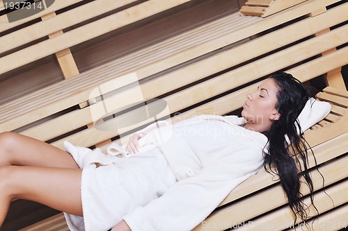 Image of Young woman take a steam bath