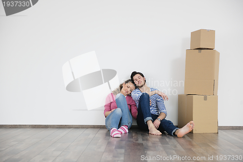 Image of Young couple moving in new home