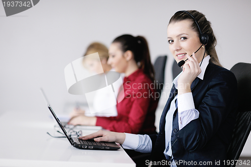 Image of business woman group with headphones