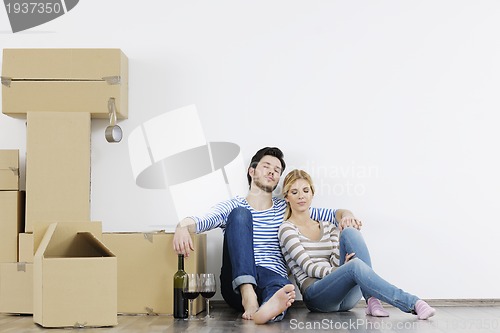 Image of Young couple moving in new home