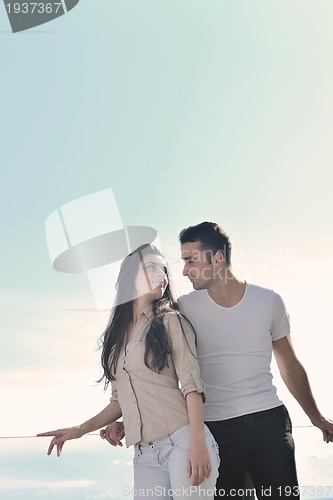 Image of couple relaxing on balcony