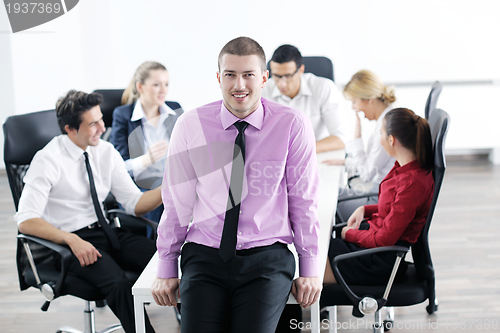 Image of young business man at meeting