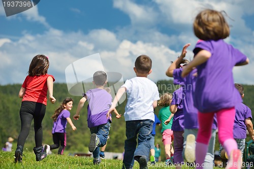 Image of happy kids group  have fun in nature