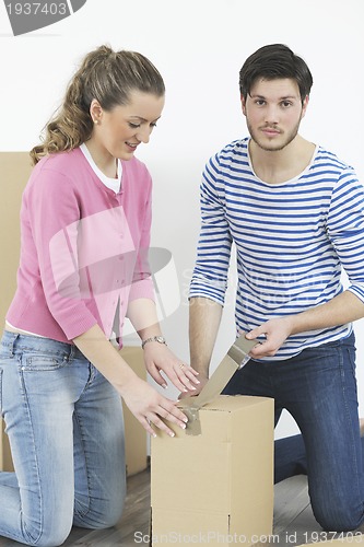 Image of Young couple moving in new home