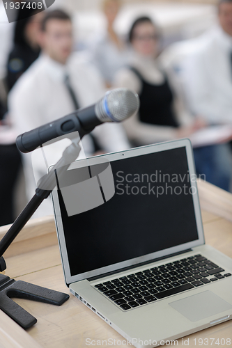 Image of laptop on conference speech podium