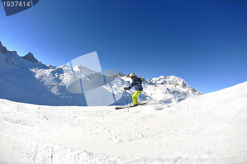 Image of skiing on fresh snow at winter season at beautiful sunny day