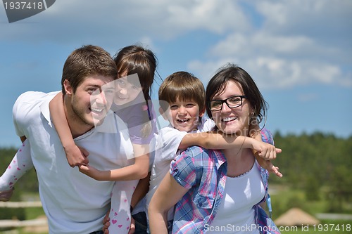 Image of happy young family have fun outdoors