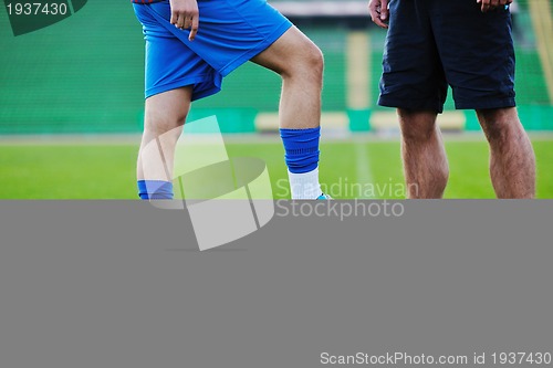 Image of football players in competition for the ball