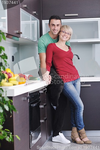 Image of young couple have fun in modern kitchen