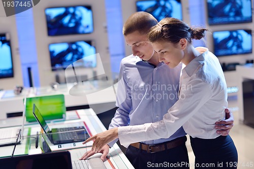 Image of people buy  in consumer electronics store