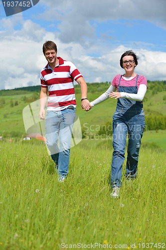 Image of romantic young couple in love together outdoor