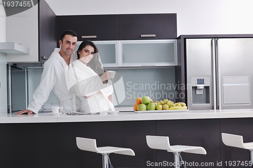 Image of young couple have fun in modern kitchen
