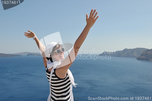 Image of Greek woman on the streets of Oia, Santorini, Greece