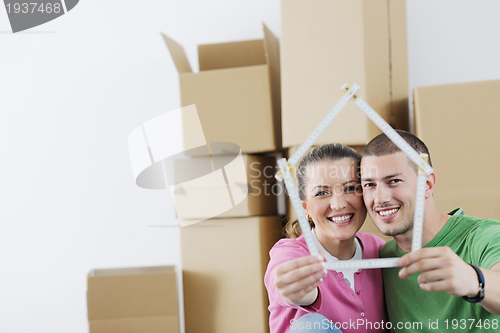 Image of Young couple moving in new home